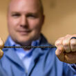 DexMat CEO Bryan Hassin holds a roughly one-foot section of Galvorn cable.
