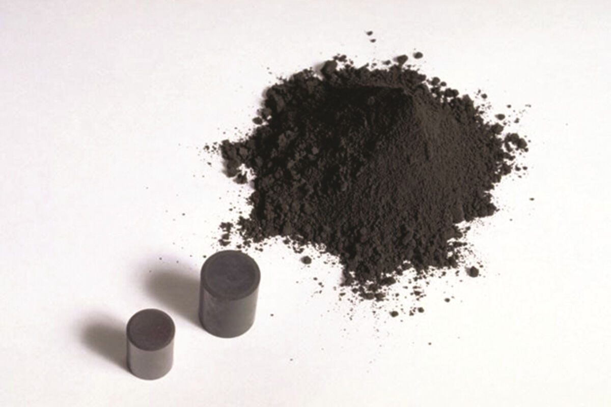 A pile of uranium powder and its pellets used in nuclear reactors.
