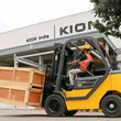 Employee operating a KION forklift in India.