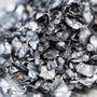 A lump of lithium-ion battery scrap to be processed by BASF and TODA.