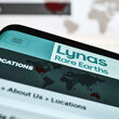 A smartphone with Lynas Rare Earths’ locations webpage opened on the screen.
