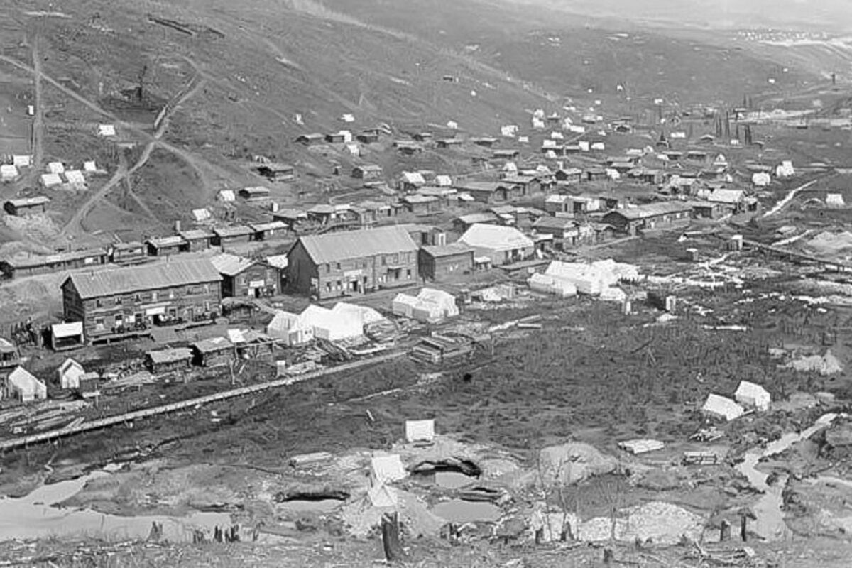 A vintage photograph of the now ghost town Grand Forks in Yukon, Canada.