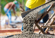 Concrete being poured at a construction site.