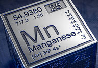 A metallic cube of the periodic table symbol and information for manganese.
