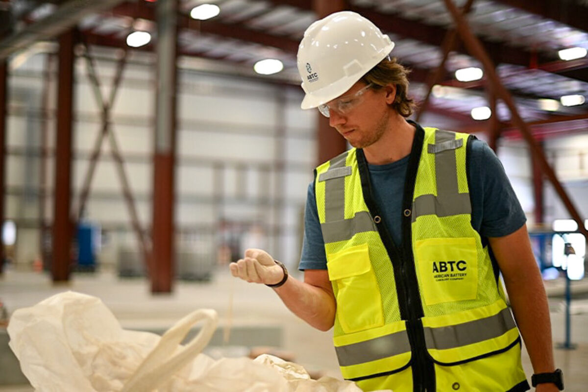 ABTC employee inspecting its lithium hydroxide product.