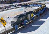 Artist rendering of at RIINO monorail hauling rocks up a steep mining slope.