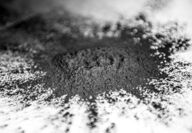 A splattered mound of finely ground recycled battery.