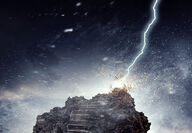 Computer image of lightning striking and pulverizing a rock pillar with stairs.