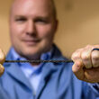 DexMat CEO Bryan Hassin holds a roughly one-foot section of Galvorn cable.