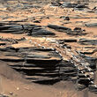 Dashed line shows opal-filled fracture cutting across layered rocks on Mars.