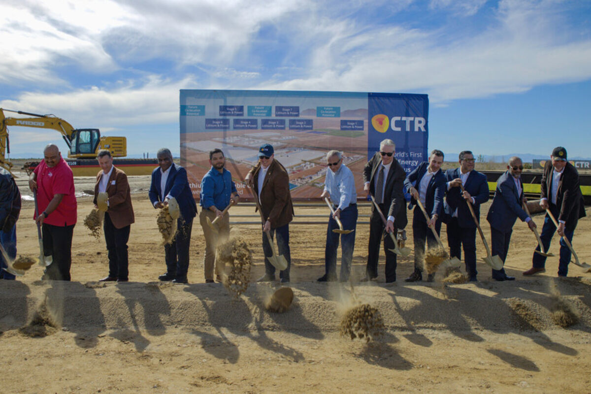Executives and dignitaries toss dirt with golden shovels at Hell’s Kitchen.