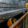 A conveyor belt transports ore to the surface at an underground mine.