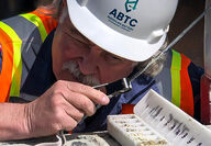 ABTC Chief Mineral Resource Officer Scott Jolcover examining samples.