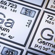 Metallic-looking tiles for gallium and germanium on the periodic table.