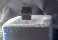 A supercooled superconductor being levitated with quantum locking.