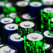 Computer graphic of lithium batteries imprinted with green digital dots.