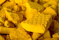 Closeup of chunks of uranium concentrate or yellowcake.