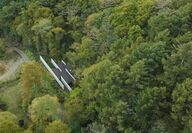 Overhead view of the Karuizawa house surrounded by trees.