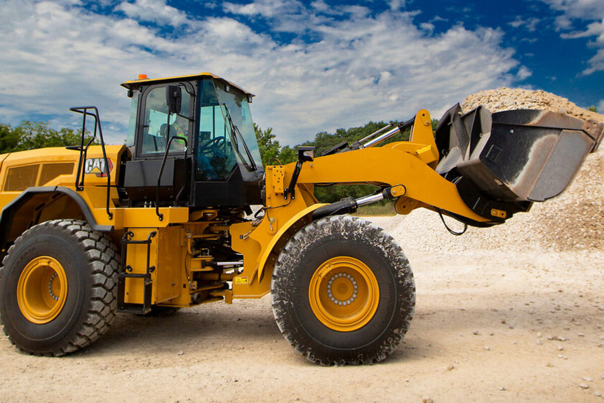 Electric%20Cat%20loader%20carrying%20a%20scoop%20of%20gravel%2E