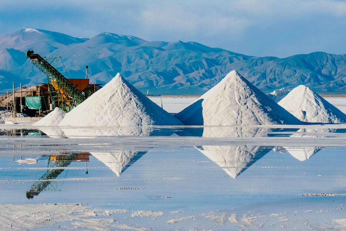 Piles of white lithium reflect off placid water at the Salinas Grandes Mine.