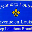 A Welcome to Louisiana road sign at the border of the Bayou State.