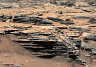 Dashed line shows opal-filled fracture cutting across layered rocks on Mars.