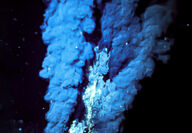 Hydrothermal black smoker vent in ocean emits metal laden sulfide fluids