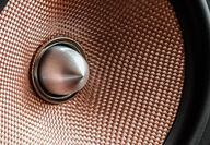 A zoomed in photo of a loudspeaker.