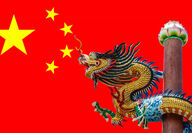 Image of a dragon in front of the flag for the People’s Republic of China.