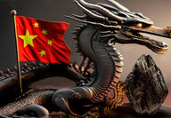 A metallic dragon with its claws on a graphite stone and the Chinese flag.