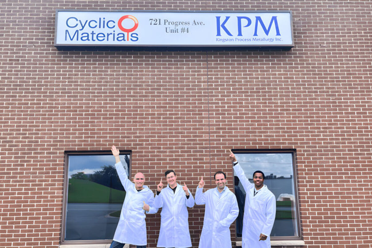 Four%20Cyclic%20Materials%20employees%20posing%20in%20front%20of%20Kingston%20plant%20in%20Canada%2E