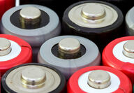 The tops of several AA-sized batteries commonly used in electronic devices.