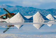 Piles of white lithium reflect off placid water at the Salinas Grandes Mine.