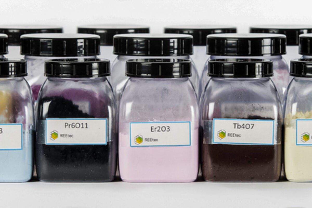 Bottles of vibrantly colored rare earth sample products produced by REEtec.