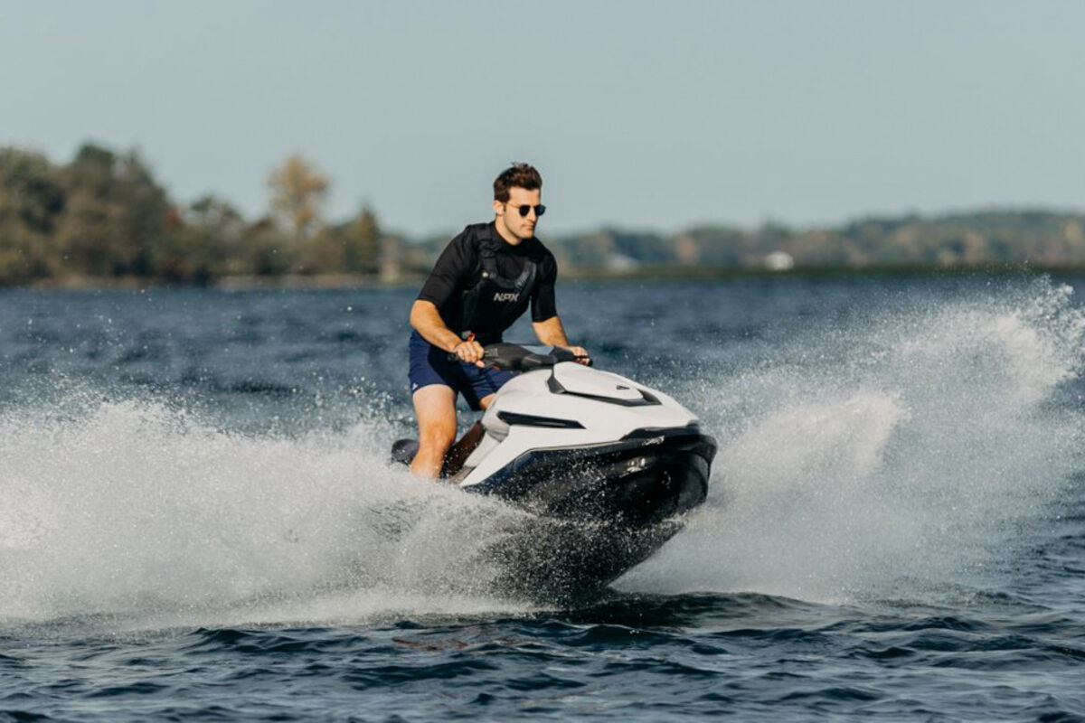 Taiga Motors newest all-electric jet ski, the Orca racing over waves.