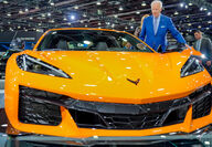 President Biden next to a Corvette Z06 showcased a the revived Detroit car show.