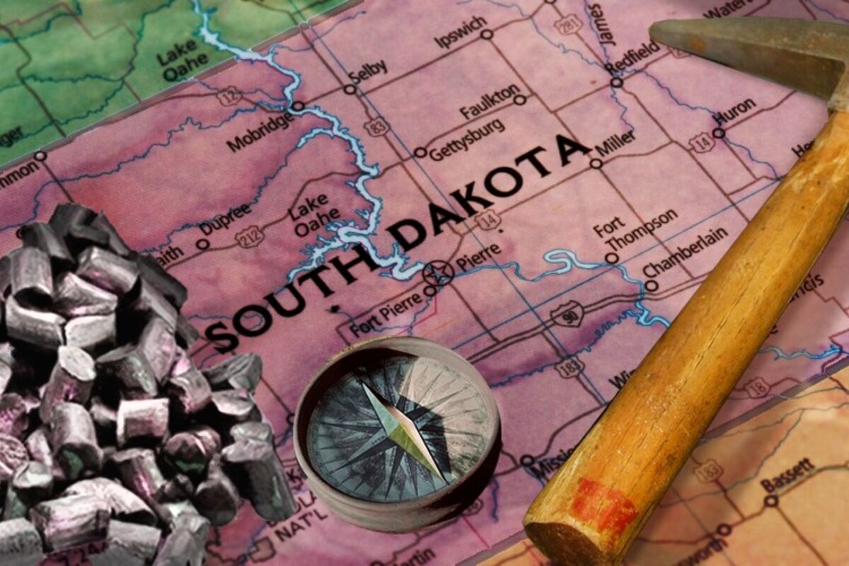 South Dakota map with lithium pellets, compass, and pick