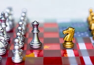 Chess board representing trade maneuvering between U.S. and China.