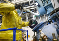 Technician tests the chemicals inside Lithion Recycling's demonstration plant.
