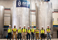ABTC employees pose for picture at opening of recycling facility.