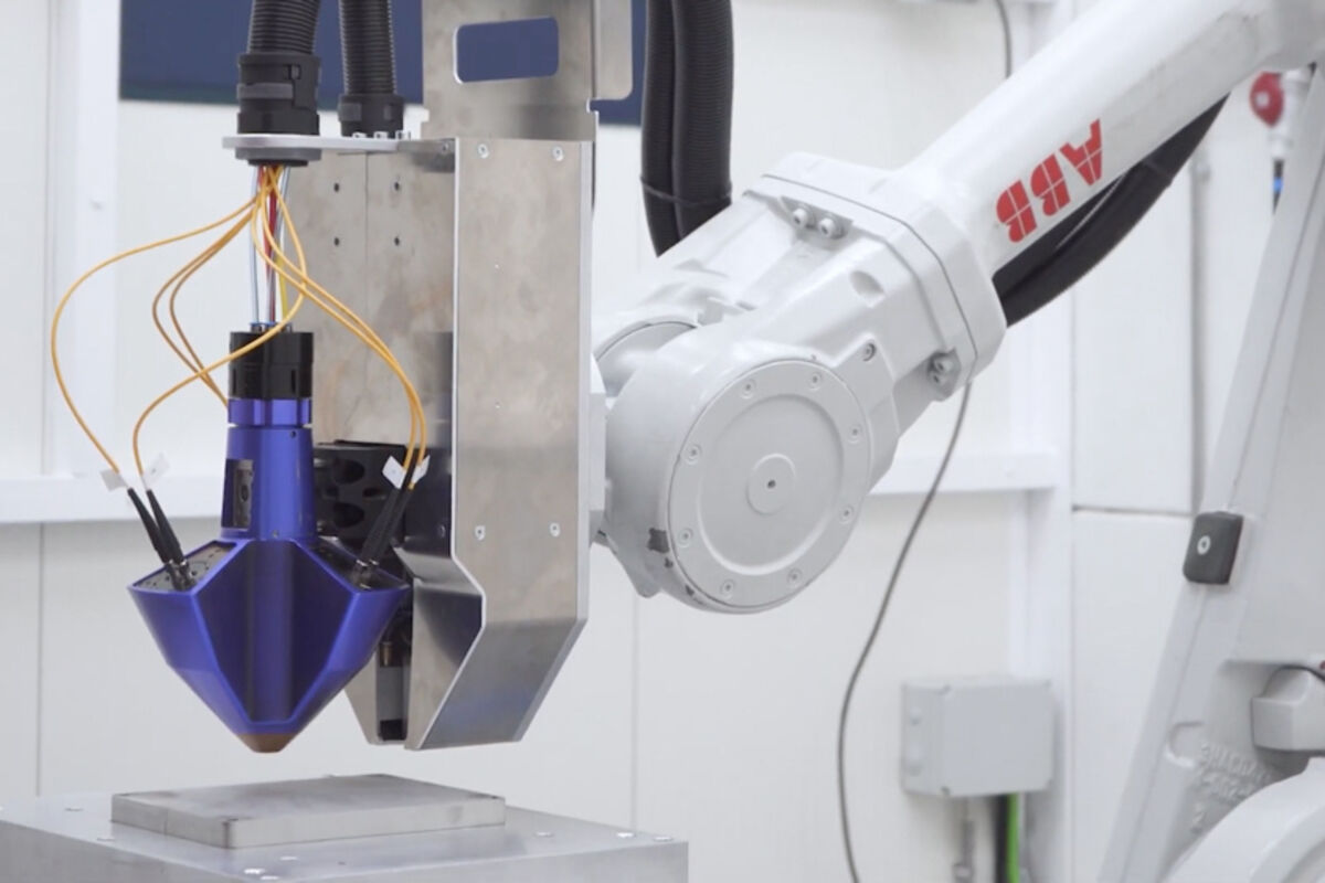 Meltio's metal 3D printer head attached to a robotic arm.