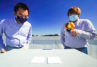 Xuilin Ruan (left) and Joseph Peoples (right) measure their whitest paint.