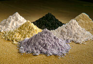 A series of rare earth elements displayed in several piles.