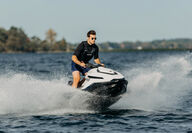 Taiga Motors newest all-electric jet ski, the Orca racing over waves.
