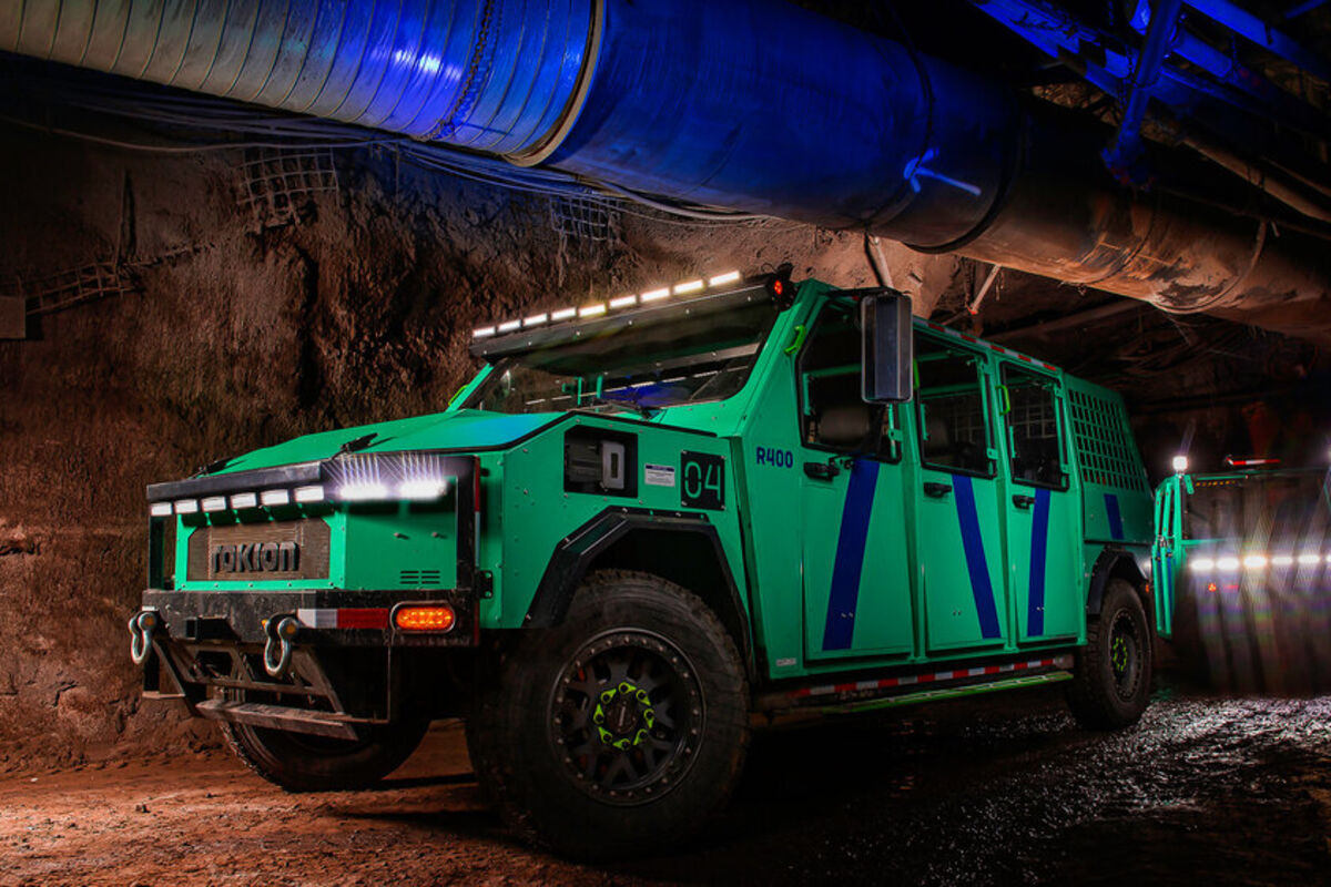 A%20green%20utility%20EV%20similar%20to%20a%20Hummer%20in%20an%20underground%20mine%20in%20Canada%2E