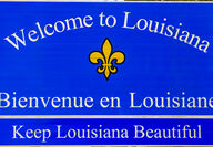 A Welcome to Louisiana road sign at the border of the Bayou State.