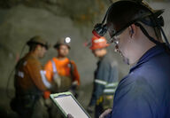An underground miner checks an electronic tablet at Hecla’s Greens Creek Mine.