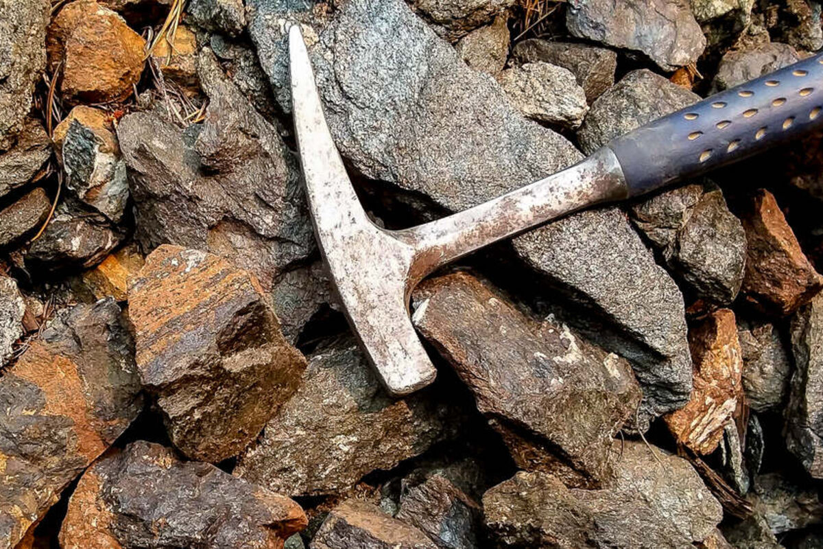 Rock hammer on a pile of rare earths-enriched rocks at Sheep Creek in Montana.