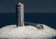 Two roughly AA-sized sodium-ion batteries on top of a pile of table salt.