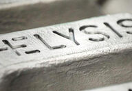 Closeup of an aluminum bar stamped with ELYSIS.